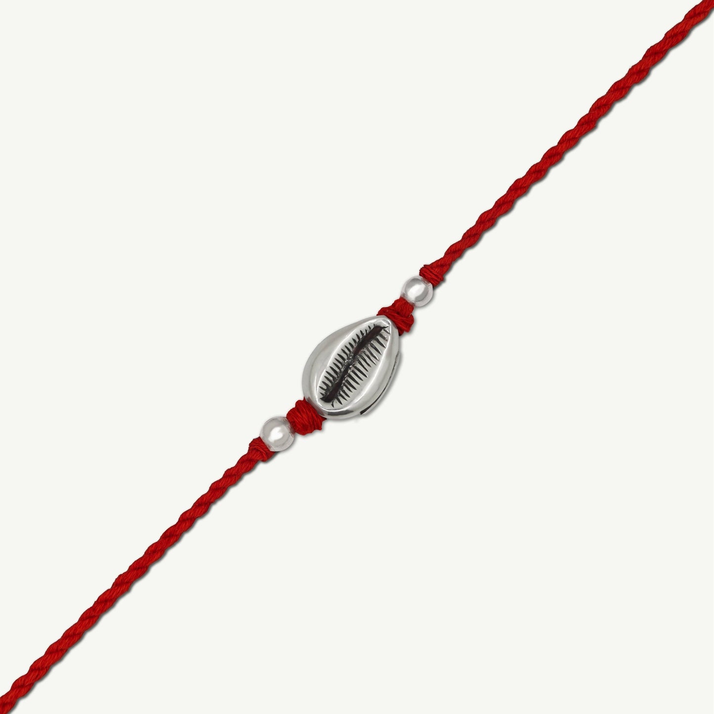 Handcrafted Silver Cowrie Rakhi - Smith Jewels