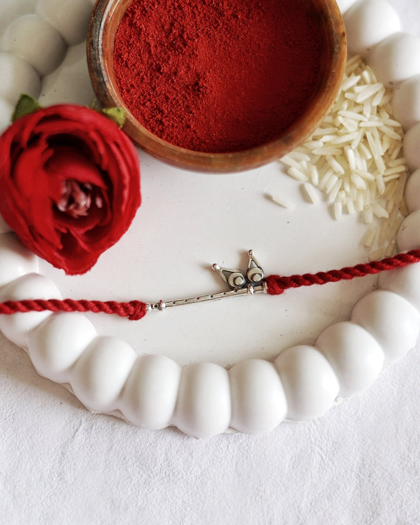Bansuri Charm Rakhi - Smith JewelsRakhi