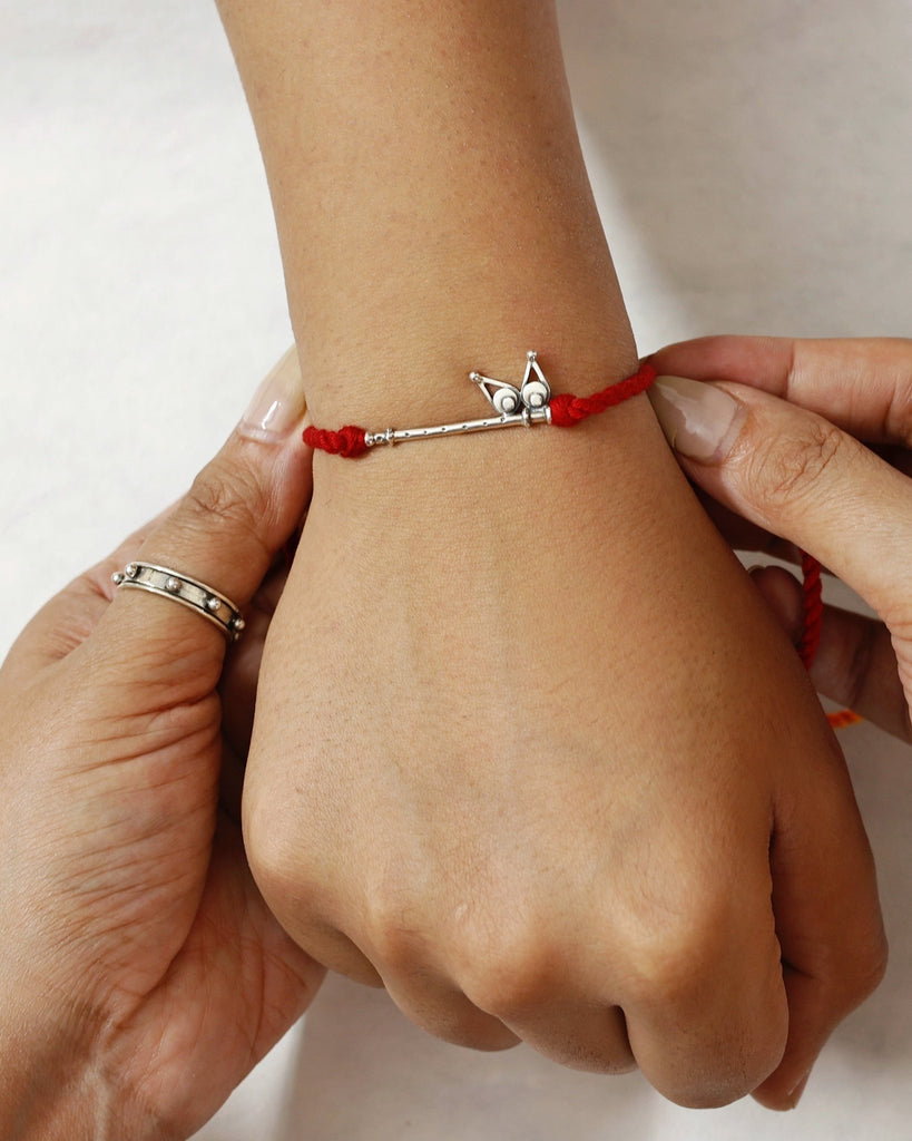 Bansuri Charm Rakhi - Smith JewelsRakhi
