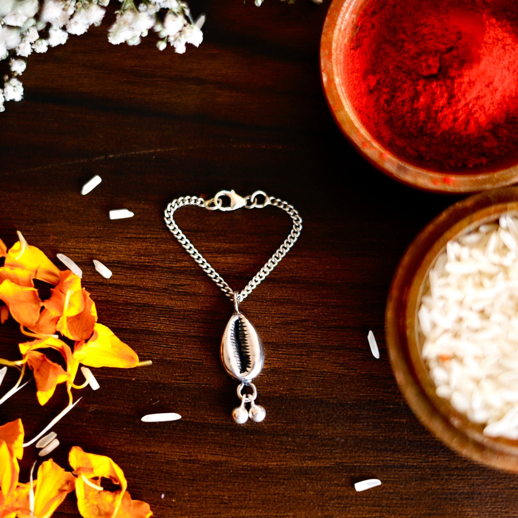 Silver Cowrie Lumba Watch Charm Rakhi - Smith JewelsRakhi