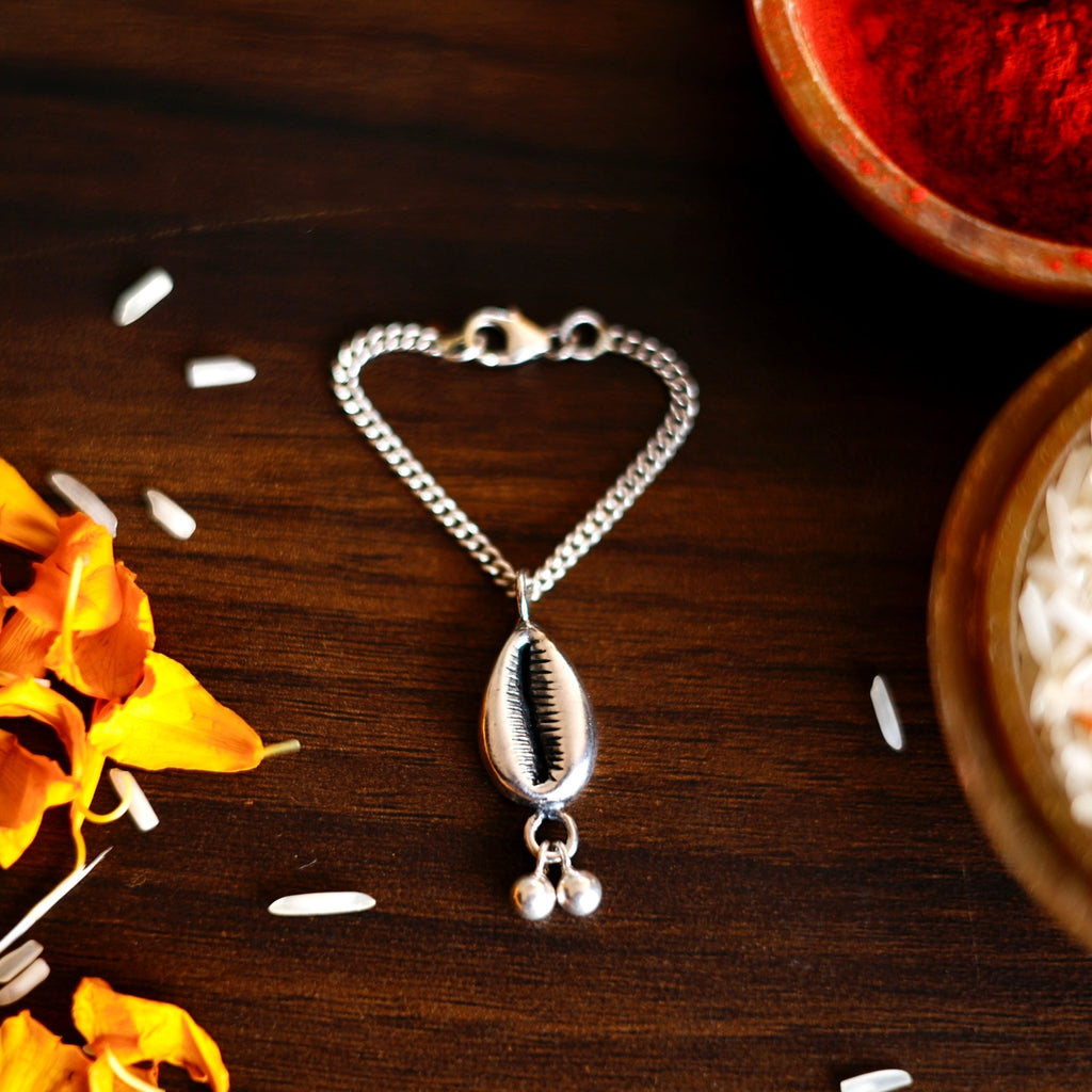 Silver Cowrie Lumba Watch Charm Rakhi - Smith JewelsRakhi