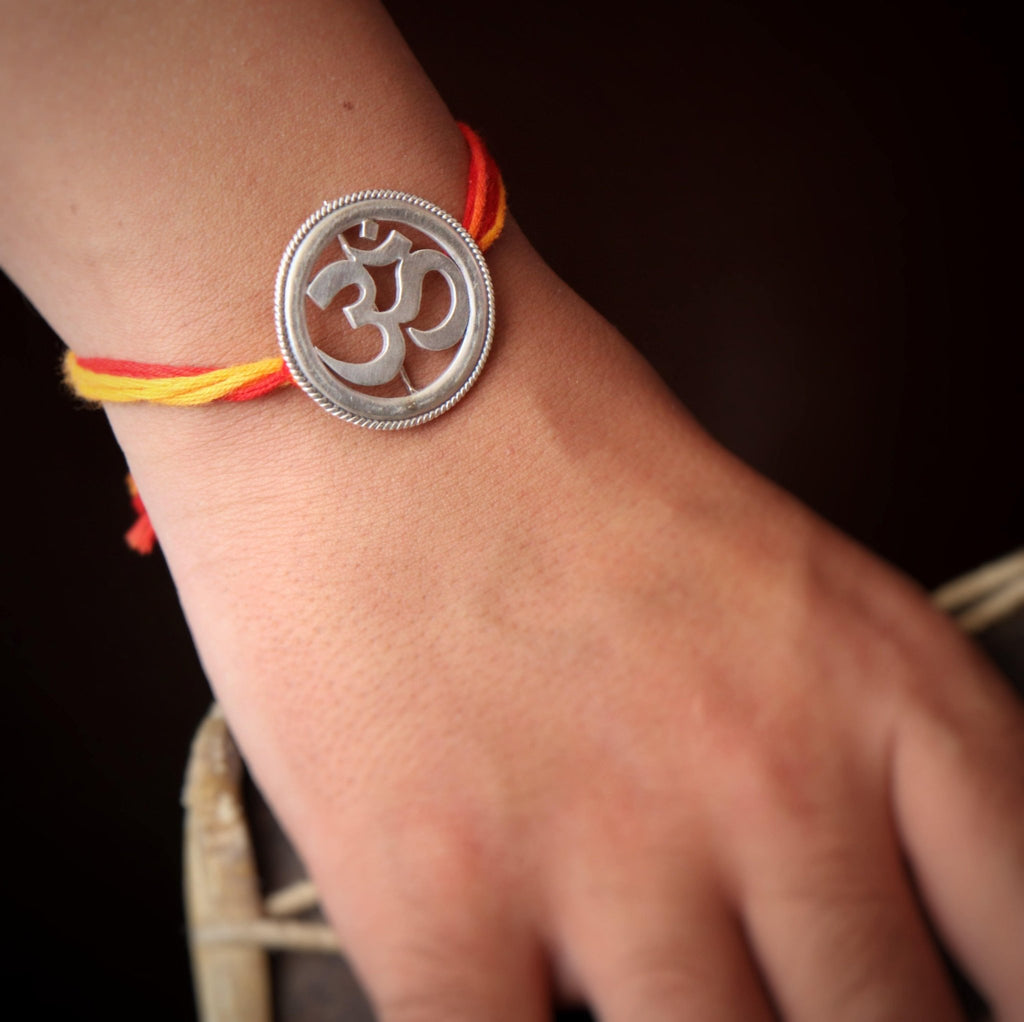 Om Rakhi cum Brooch - Smith JewelsRakhi